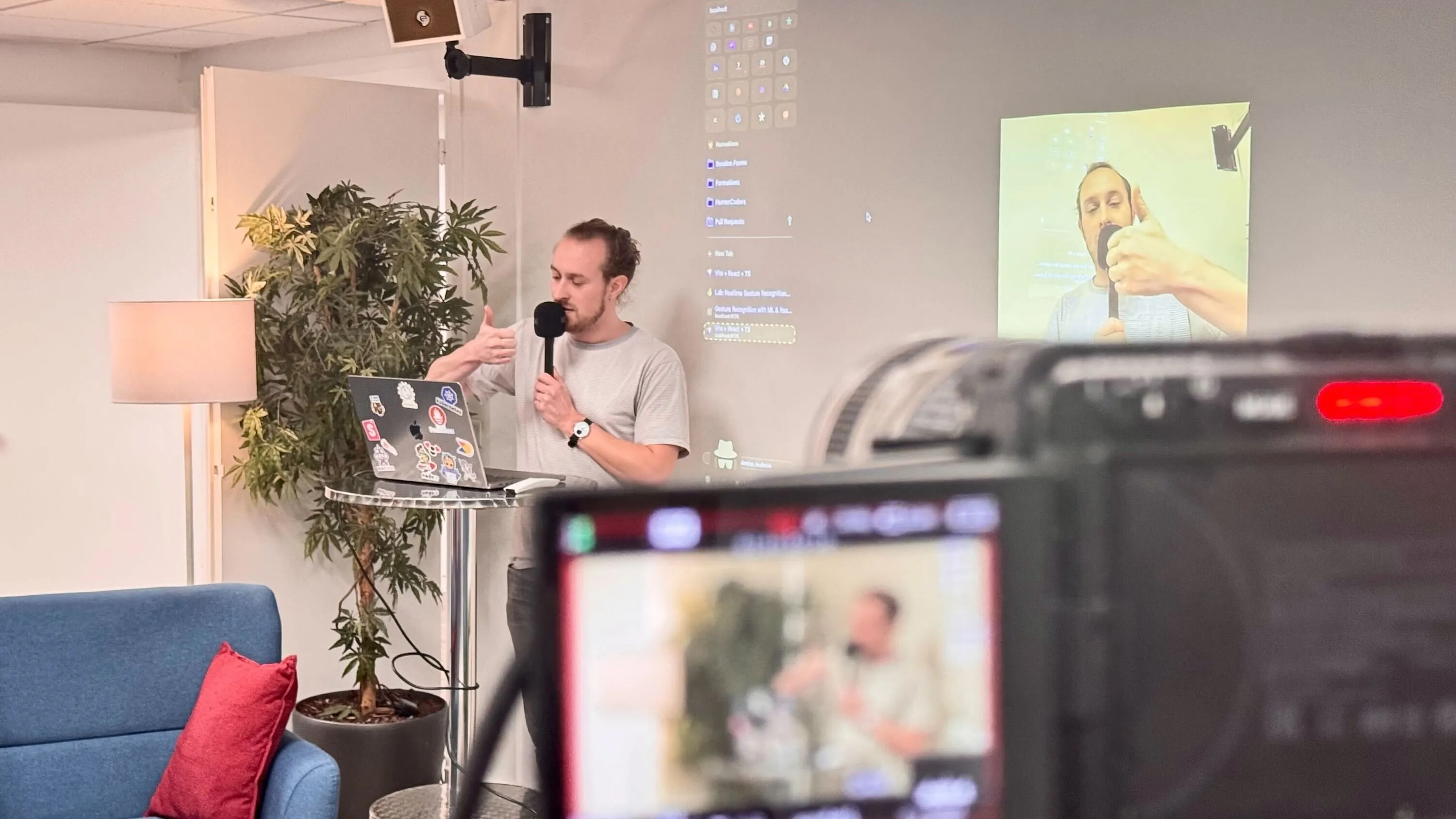 Gabriel doing hand gestures for his talk